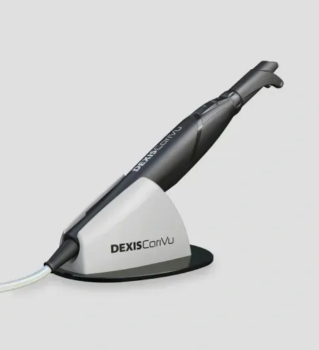 DEXIS CariVu dental imaging device resting in its charging base stand